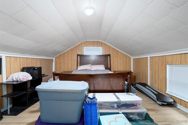 16 Meadow St, Kirkland, NY 13323 - bedroom featuring light wood-style flooring, lofted ceiling, and wood walls