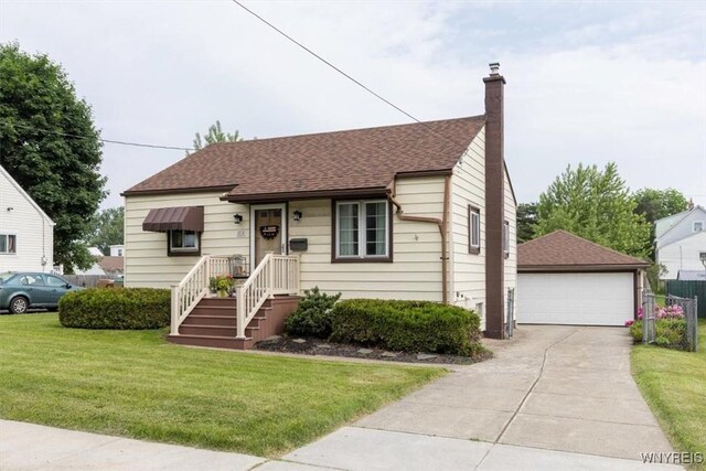210 Evergreen Pl, Cheektowaga, NY 14225 - view of front of home featuring a chimney, a detached garage, a front lawn, an outdoor structure, and roof with shingles