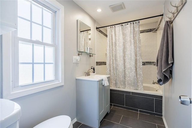 262 Barry Rd, Irondequoit, NY 14617 - full bathroom featuring tiled shower / bath combo, vanity, healthy amount of natural light, tile patterned flooring, and recessed lighting