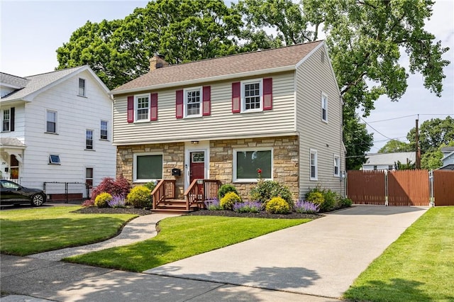 262 Barry Rd, Irondequoit, NY 14617 - view of front of property featuring stone siding, a chimney, driveway, and a gate
