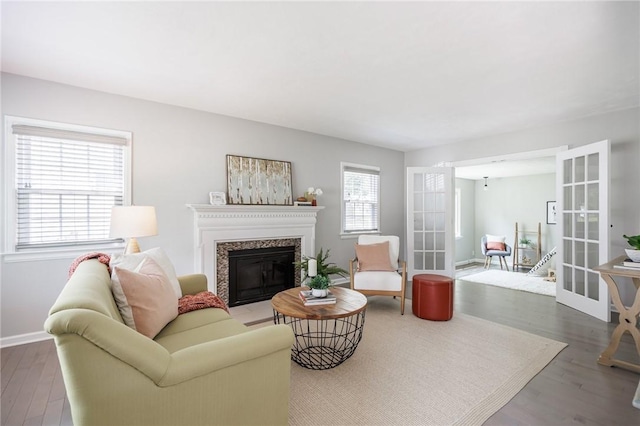 262 Barry Rd, Irondequoit, NY 14617 - living room featuring a fireplace with flush hearth, wood finished floors, and french doors