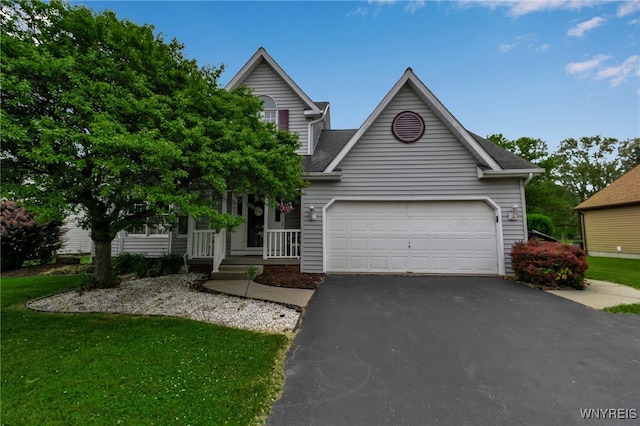 33 Sausalito Dr, Amherst, NY 14051 - view of front of house featuring asphalt driveway, an attached garage, a front yard, a porch, and a shingled roof