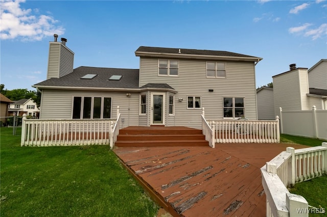 33 Sausalito Dr, Amherst, NY 14051 - rear view of property with a deck, a fenced backyard, and a chimney
