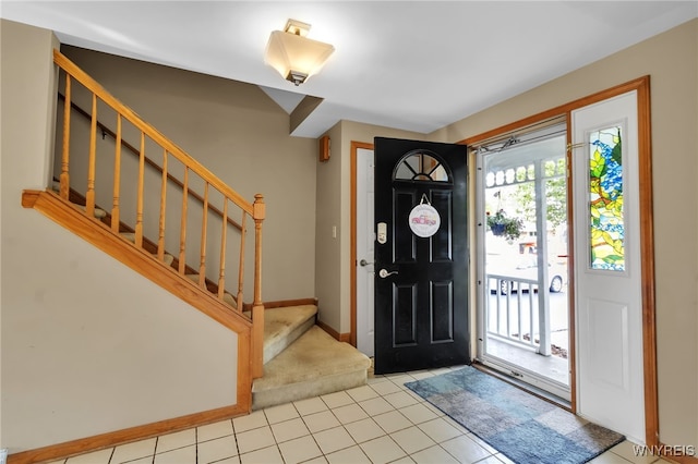 33 Sausalito Dr, Amherst, NY 14051 - entryway with light tile patterned flooring and stairway