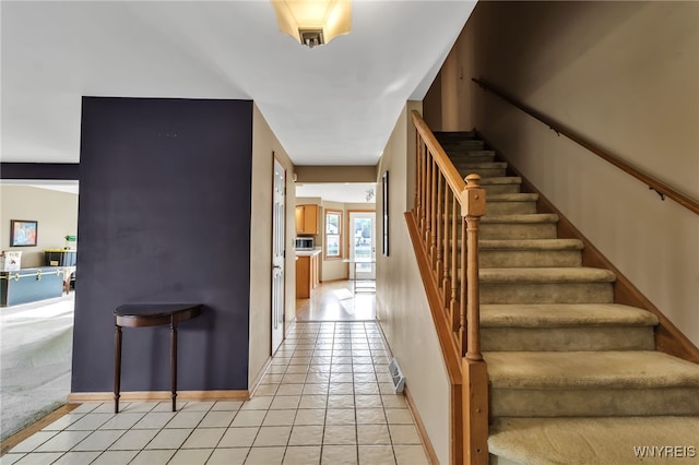 33 Sausalito Dr, Amherst, NY 14051 - stairs featuring baseboards and tile patterned flooring