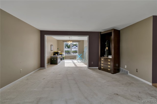 33 Sausalito Dr, Amherst, NY 14051 - hallway featuring a chandelier and light carpet