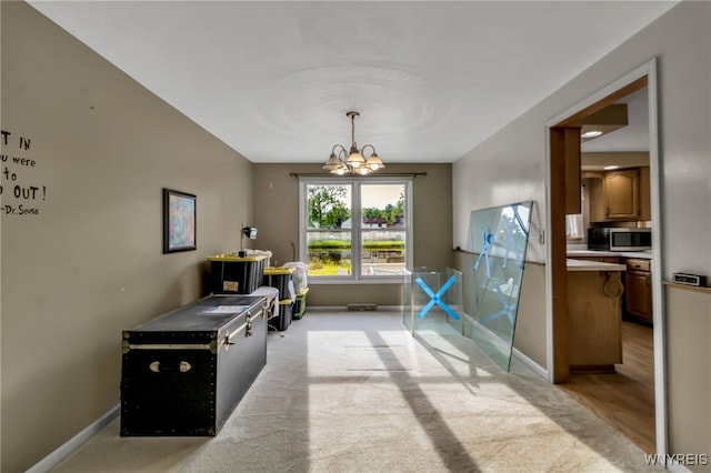 33 Sausalito Dr, Amherst, NY 14051 - dining space featuring a chandelier and light colored carpet