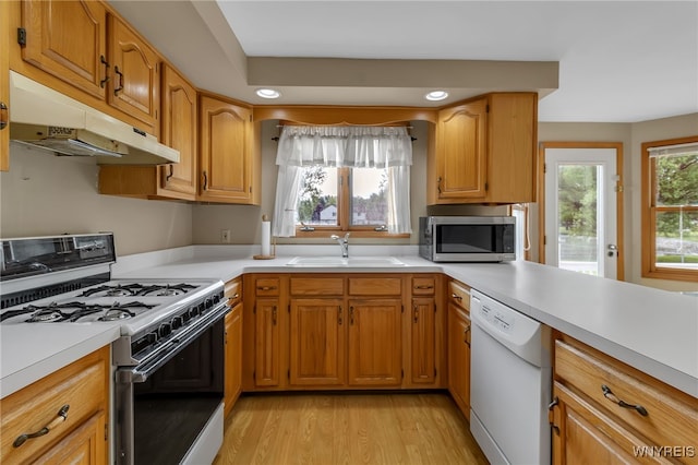 33 Sausalito Dr, Amherst, NY 14051 - kitchen featuring white appliances, under cabinet range hood, light countertops, light wood-style floors, and recessed lighting