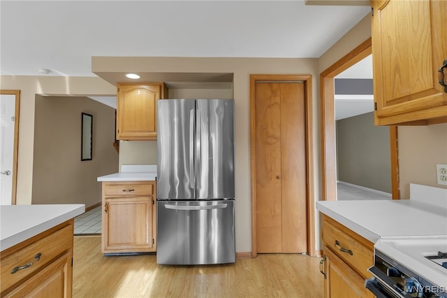 33 Sausalito Dr, Amherst, NY 14051 - kitchen featuring freestanding refrigerator, light countertops, and light wood-style flooring