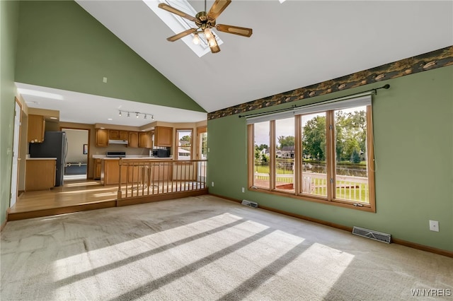 33 Sausalito Dr, Amherst, NY 14051 - unfurnished living room with light carpet, a ceiling fan, and high vaulted ceiling