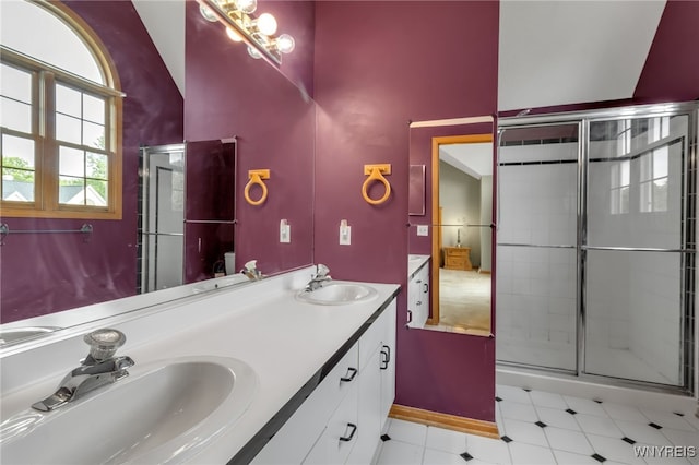 33 Sausalito Dr, Amherst, NY 14051 - bathroom featuring double vanity, a shower stall, and vaulted ceiling