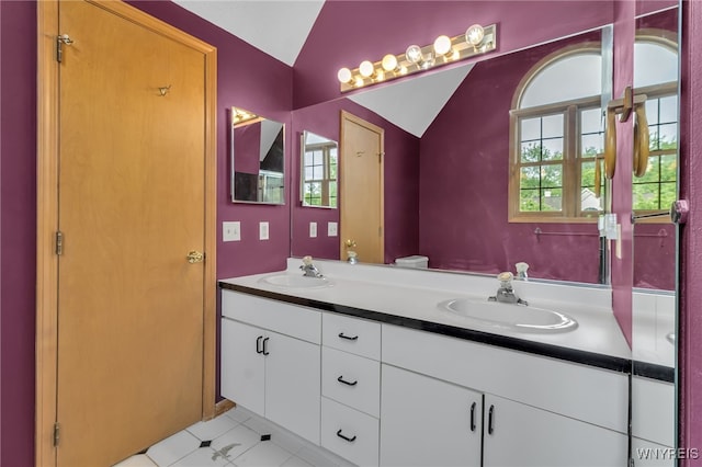 33 Sausalito Dr, Amherst, NY 14051 - full bathroom featuring vaulted ceiling, double vanity, and tile patterned floors