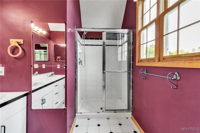 33 Sausalito Dr, Amherst, NY 14051 - bathroom featuring two vanities, a shower stall, and tile patterned flooring