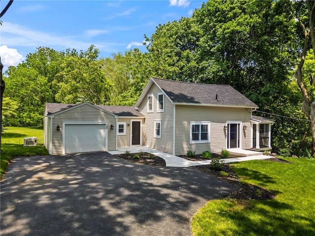 38 Richs Dugway Rd, Brighton, NY 14625 - view of front facade with driveway, a garage, roof with shingles, and a front lawn