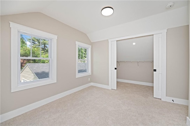 38 Richs Dugway Rd, Brighton, NY 14625 - unfurnished bedroom with lofted ceiling, light colored carpet, and a closet