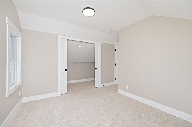 38 Richs Dugway Rd, Brighton, NY 14625 - unfurnished bedroom with lofted ceiling, carpet flooring, and a closet