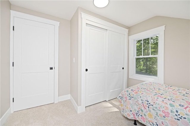 38 Richs Dugway Rd, Brighton, NY 14625 - bedroom with light colored carpet, a closet, and vaulted ceiling