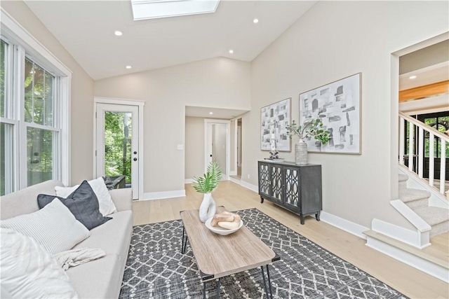 38 Richs Dugway Rd, Brighton, NY 14625 - living room with wood finished floors, vaulted ceiling, recessed lighting, stairs, and a skylight