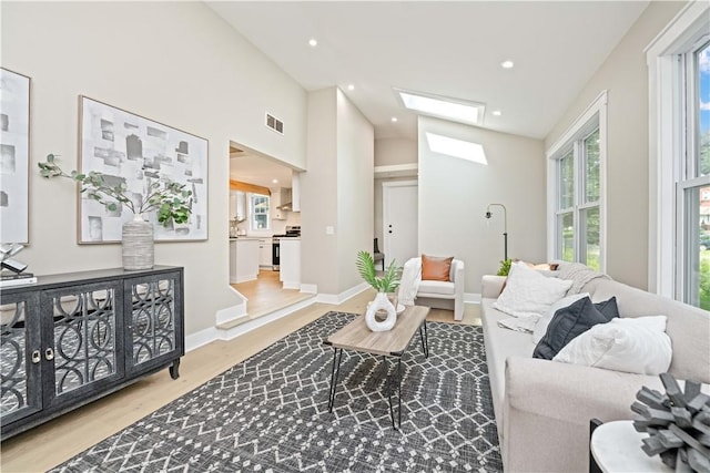38 Richs Dugway Rd, Brighton, NY 14625 - living area with wood finished floors, recessed lighting, and a skylight