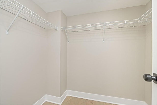 38 Richs Dugway Rd, Brighton, NY 14625 - walk in closet featuring wood finished floors