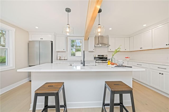 38 Richs Dugway Rd, Brighton, NY 14625 - kitchen with a kitchen breakfast bar, white cabinets, wall chimney range hood, stainless steel range, and recessed lighting