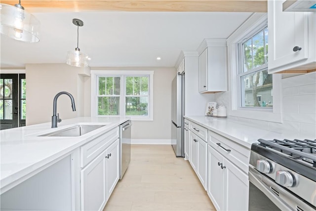 38 Richs Dugway Rd, Brighton, NY 14625 - kitchen featuring stainless steel appliances, white cabinets, light countertops, plenty of natural light, and recessed lighting