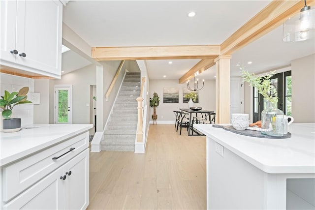 38 Richs Dugway Rd, Brighton, NY 14625 - kitchen with healthy amount of natural light, white cabinets, light wood-style floors, light countertops, and recessed lighting