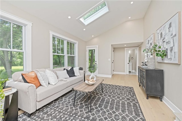 38 Richs Dugway Rd, Brighton, NY 14625 - living area with a skylight, plenty of natural light, light wood-type flooring, vaulted ceiling, and recessed lighting