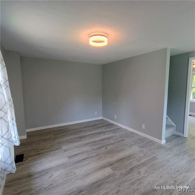 504 Breman Ave, Salina, NY 13211 - empty room with wood finished floors and baseboards