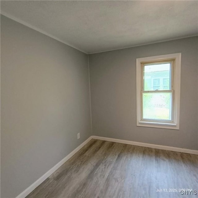 504 Breman Ave, Salina, NY 13211 - empty room featuring wood finished floors and baseboards