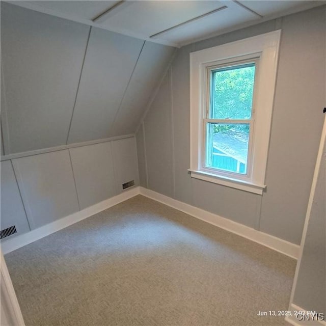 504 Breman Ave, Salina, NY 13211 - additional living space with carpet, a decorative wall, and lofted ceiling