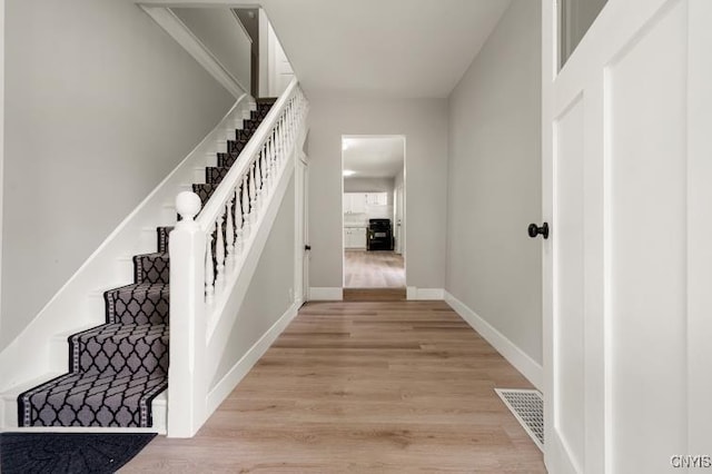 321 Pleasant Ave, Oneida-Inside, NY 13421 - staircase with wood finished floors and baseboards