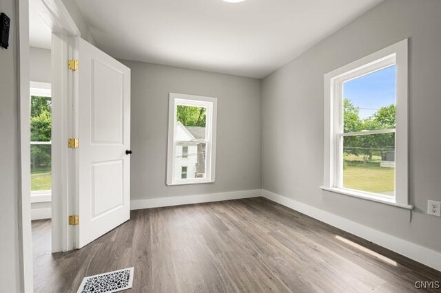 321 Pleasant Ave, Oneida-Inside, NY 13421 - spare room with wood finished floors and baseboards