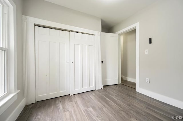 321 Pleasant Ave, Oneida-Inside, NY 13421 - unfurnished bedroom with wood finished floors and a closet