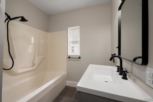 321 Pleasant Ave, Oneida-Inside, NY 13421 - bathroom featuring vanity, washtub / shower combination, and wood finished floors