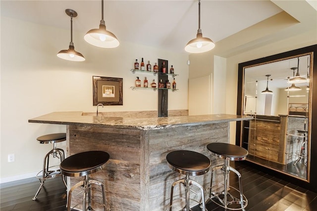 5 Elmwood Hill Ln, Brighton, NY 14610 - indoor wet bar with dark wood-style floors and hanging light fixtures