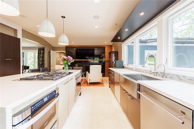 5 Elmwood Hill Ln, Brighton, NY 14610 - kitchen with appliances with stainless steel finishes, modern cabinets, light countertops, decorative light fixtures, and light tile patterned floors