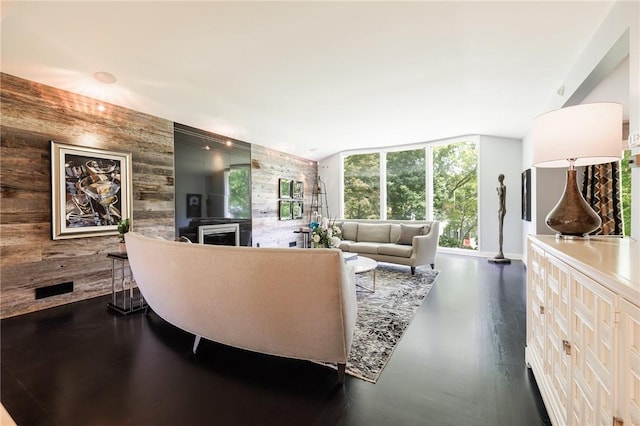 5 Elmwood Hill Ln, Brighton, NY 14610 - living area with wood walls, an accent wall, and a fireplace