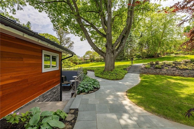 5 Elmwood Hill Ln, Brighton, NY 14610 - view of grassy yard with a patio