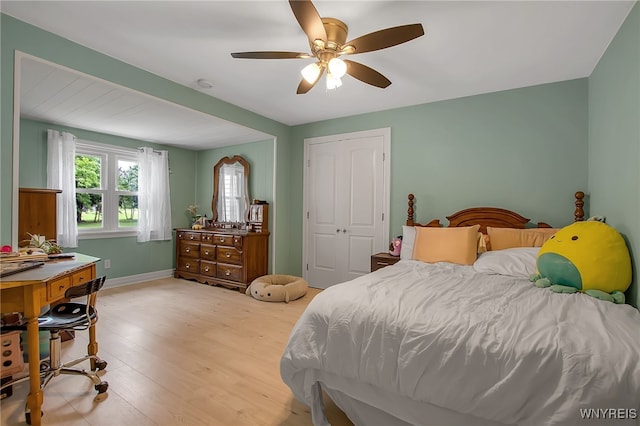 2391 Hess Rd, Newfane, NY 14008 - bedroom with light wood-style flooring, ceiling fan, and a closet