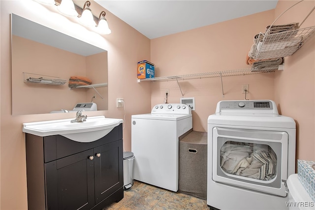 2391 Hess Rd, Newfane, NY 14008 - laundry area with washing machine and clothes dryer and cabinet space