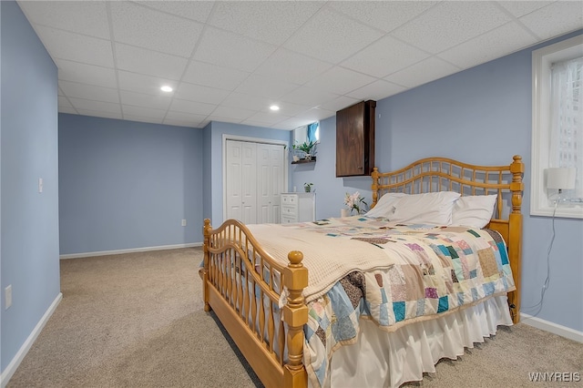 2391 Hess Rd, Newfane, NY 14008 - carpeted bedroom featuring a closet, a paneled ceiling, and recessed lighting