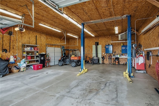 2391 Hess Rd, Newfane, NY 14008 - garage with a workshop area and a garage door opener