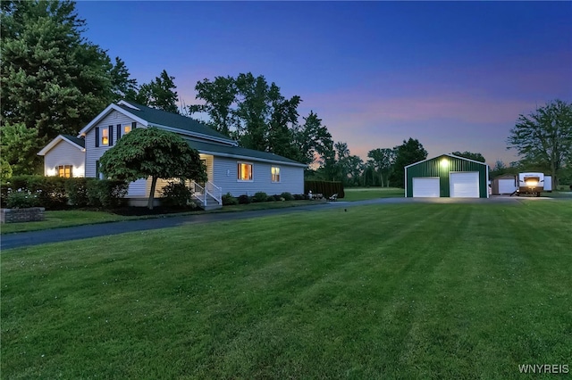 2391 Hess Rd, Newfane, NY 14008 - view of front of home with a detached garage, an outbuilding, and a yard