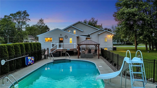 2391 Hess Rd, Newfane, NY 14008 - rear view of house with a gazebo, a fenced backyard, a patio area, and an outdoor living space