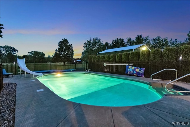 2391 Hess Rd, Newfane, NY 14008 - view of swimming pool featuring a water slide, a patio area, and a fenced backyard