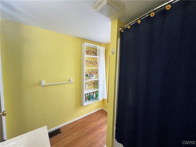 41 Evergreen St, Cortland, NY 13045 - full bathroom with wood finished floors and a shower with curtain