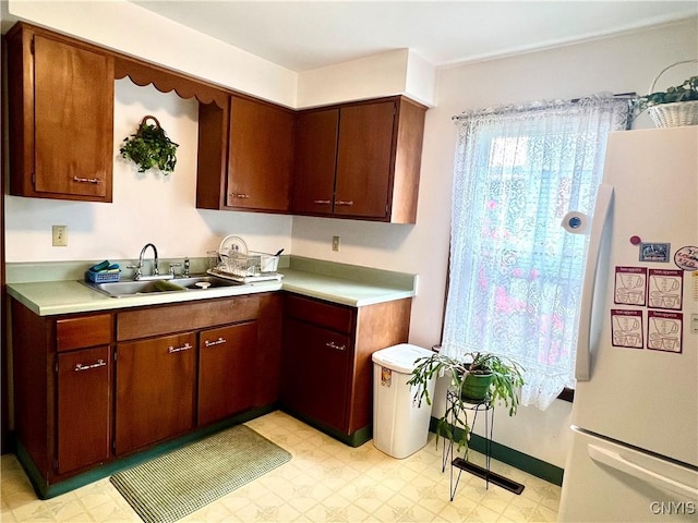 41 Evergreen St, Cortland, NY 13045 - kitchen with freestanding refrigerator, light floors, and light countertops
