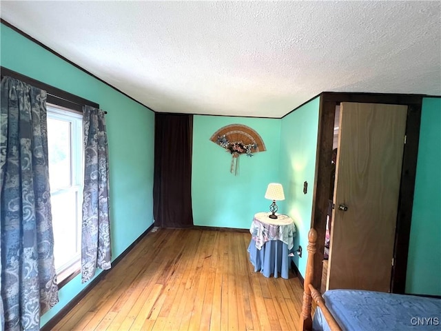 41 Evergreen St, Cortland, NY 13045 - spare room with a textured ceiling and hardwood / wood-style flooring
