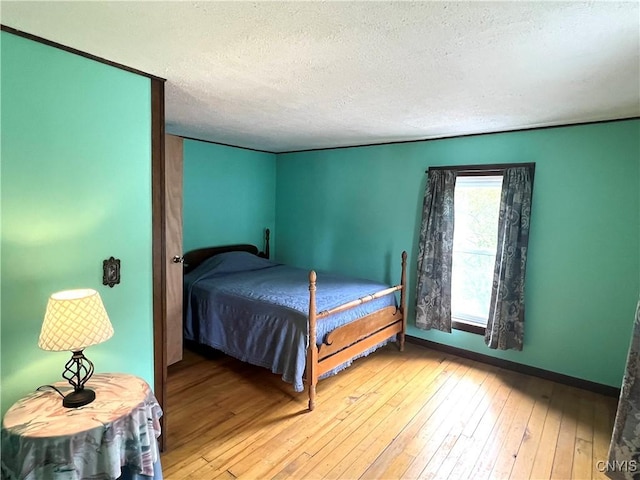 41 Evergreen St, Cortland, NY 13045 - bedroom with a textured ceiling and hardwood / wood-style flooring